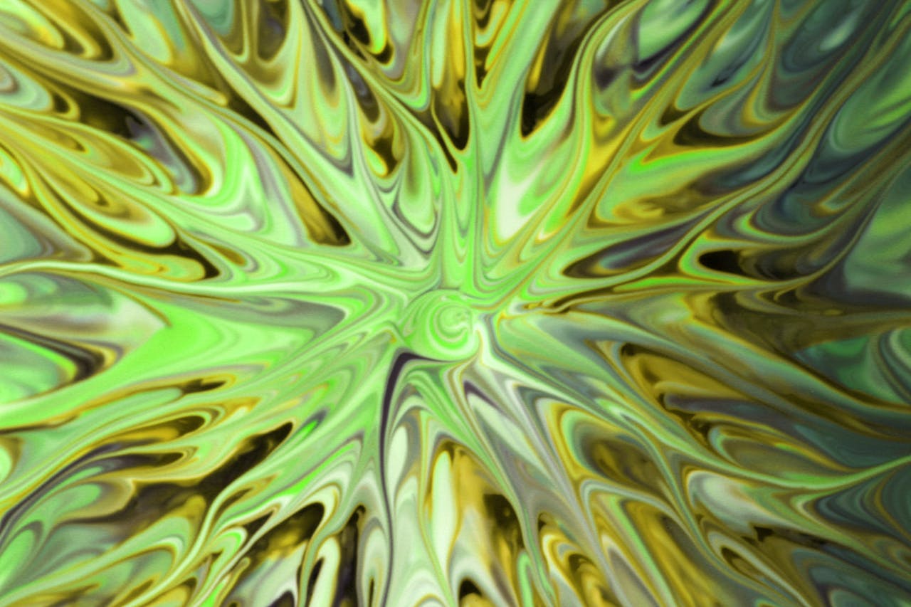 Abstract fluid art swirl in vibrant green, gold, and black tones radiating from a central spiral point.